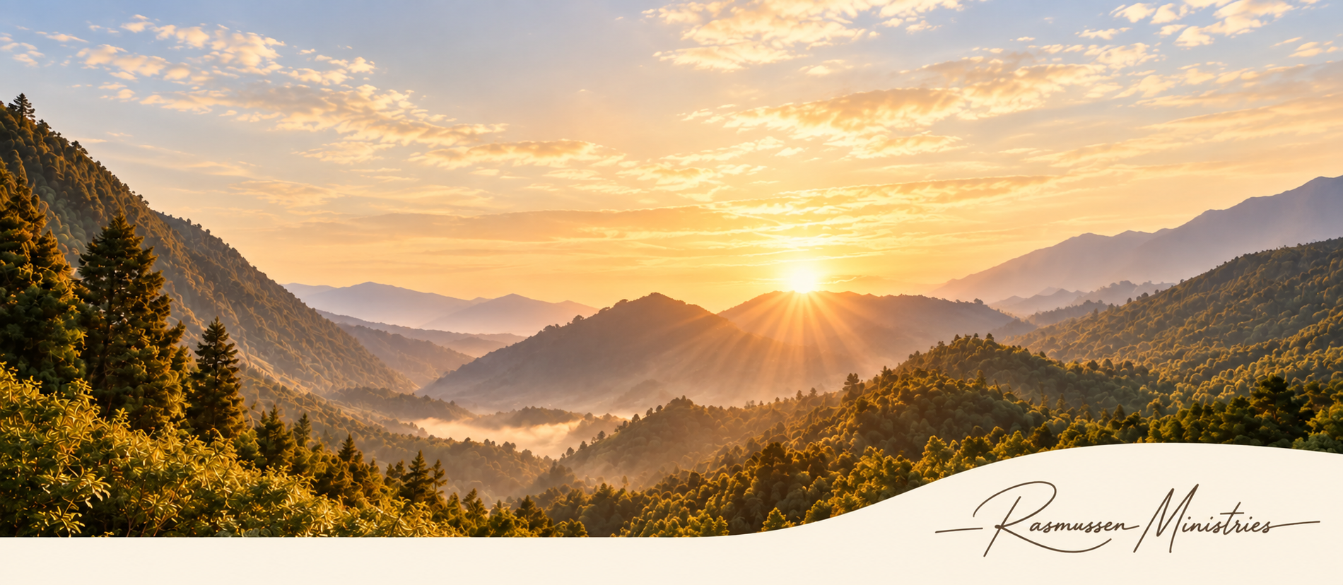 Sunrise over misty mountain valleys